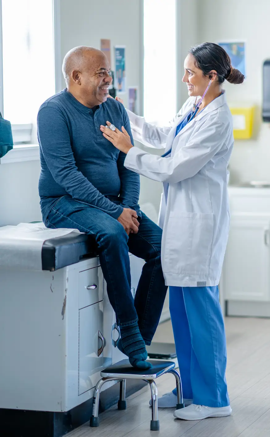 doctor helping patient